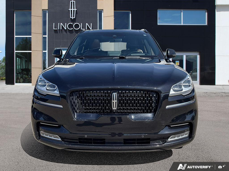 USED 2022 Lincoln Aviator Reserve - Infinite Black Metallic Exterior / ROAST, PREMIUM LEATHER HEATED/VENTILATED CAPTAIN'S CHAIRS Interior - $37,888 - Stock #E60697A - VIN 5LM5J7XC2NGL16955 - Photo 2