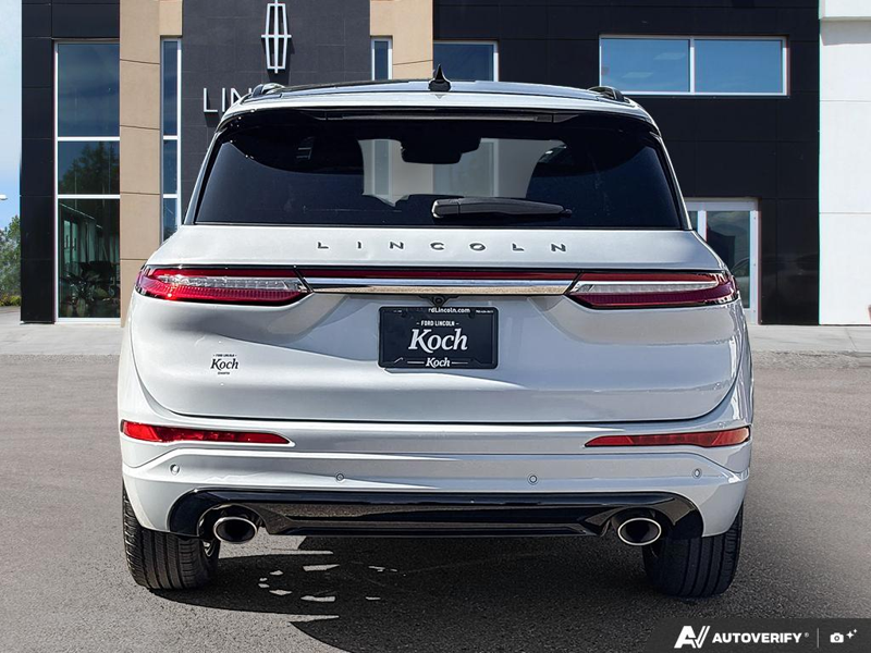 USED 2025 Lincoln Corsair Grand Touring - Crystal White Metallic Clearcoat Exterior / EBONY/ETERNAL RED, PREMIUM LEATHER-TRIMMED HEATED CAPTAIN'S CHAI Interior - $53,967 - Stock #EP4745 - VIN 5LMTJ5DZ8SUL12975 - Photo 5