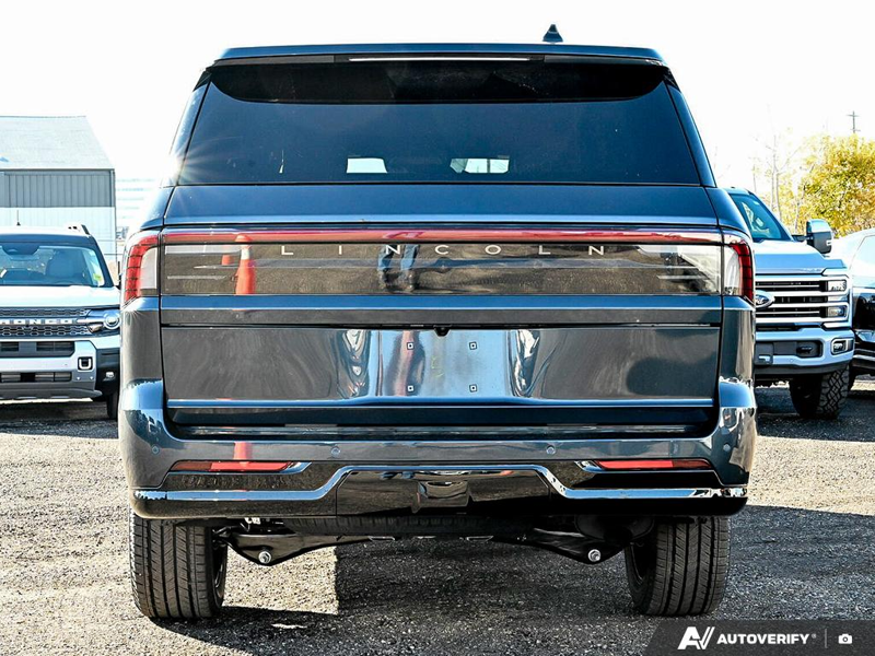 NEW 2025 Lincoln Navigator L Reserve - Flight Blue Clearcoat Exterior / HOT CHOCOLATE LEATHER Interior - $124,989 - Stock #E51320 - VIN 5LMJJ3LG3SEL16762 - Photo 5